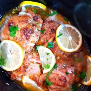Tender & Juicy low carb slow cooker chicken thighs in lemon & garlic sauce. If you’re looking for a hearty comfort food recipe then try this easy keto slow cooker chicken thighs. Easy slow cooker chicken thigh recipes. Crockpot chicken thighs bone in.#ketocrockpot #ketocrockpotchicken #lowcarbcrockpot #ketoslowcookerrecipes